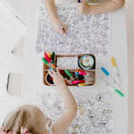 Child colouring safari animals on a reusable Seek n Spot silicone mat